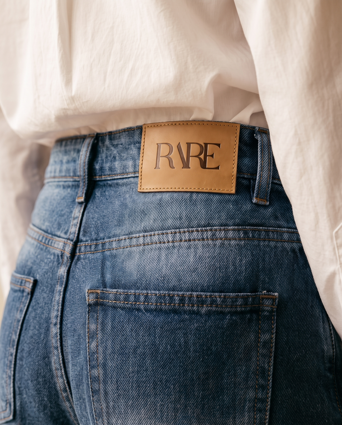 RARE Sapphire mid blue jeans, back waistband detail with the tan leather RARE patch