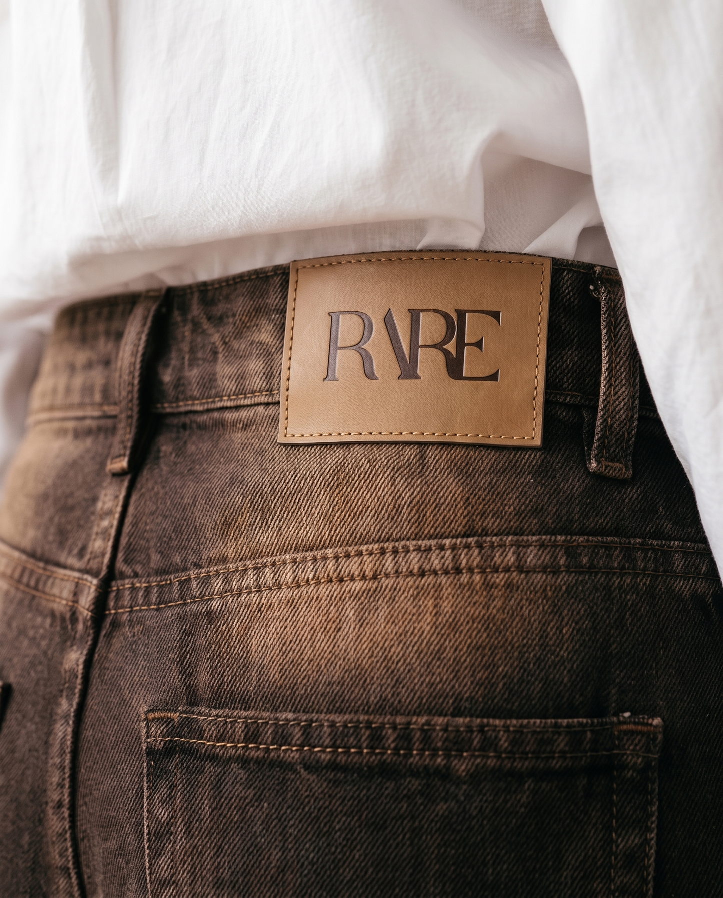 RARE Amber brown jeans, back waistband detail with the tan leather RARE patch