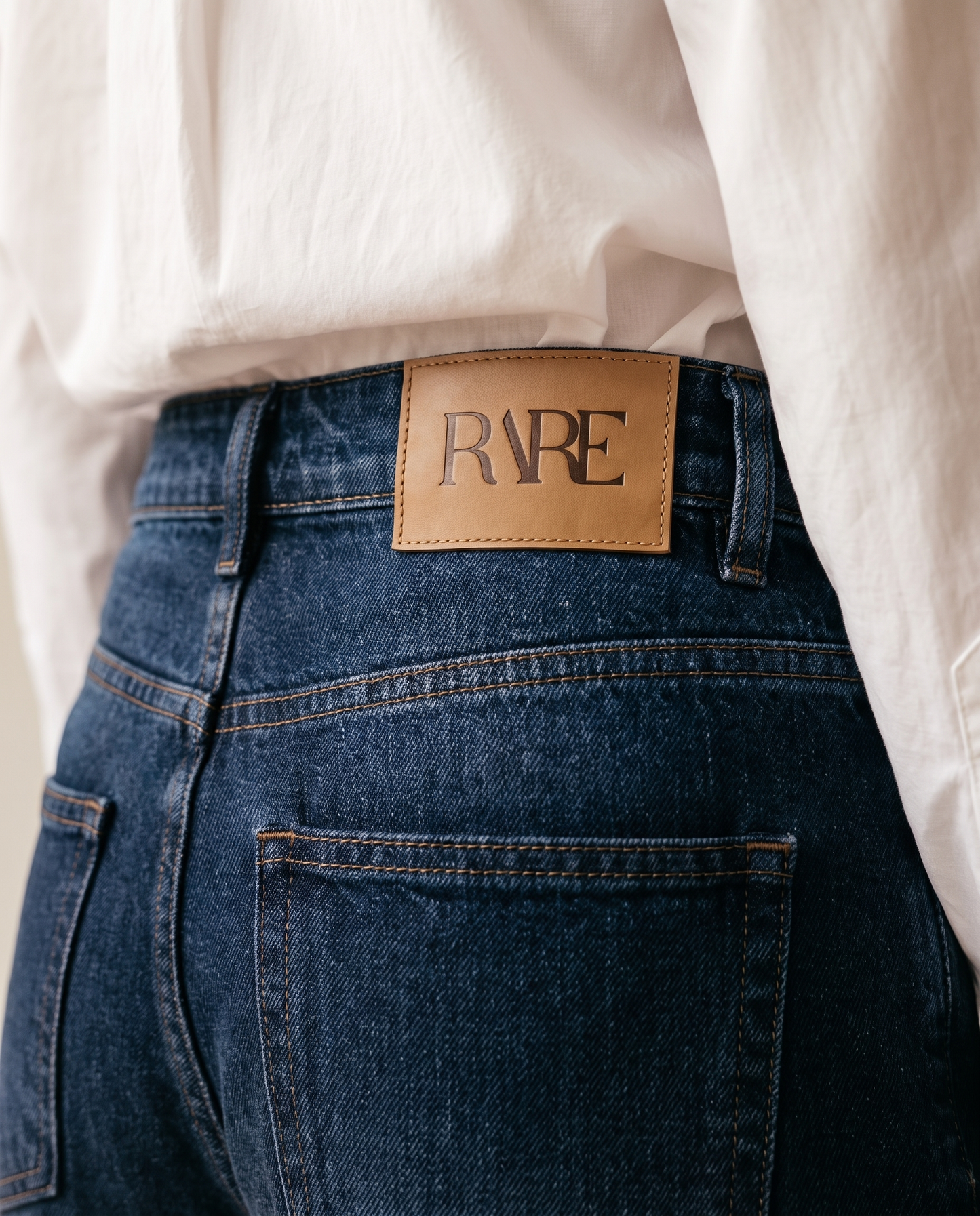 RARE Lapis jeans, solid indigo back waistband detail with the tan leather RARE patch