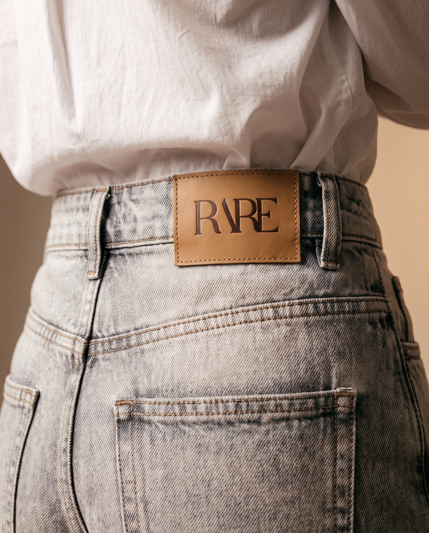 RARE Quartz grey acid wash jeans, back waistband detail with the tan leather RARE patch
