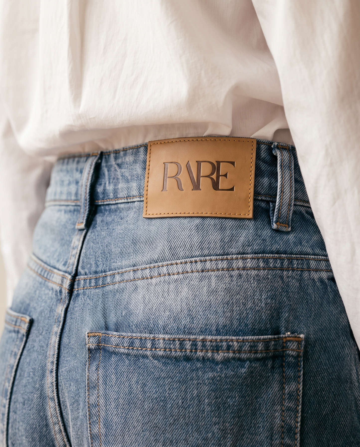 RARE Opal light blue double waist jeans, back waistband detail with the tan leather RARE patch
