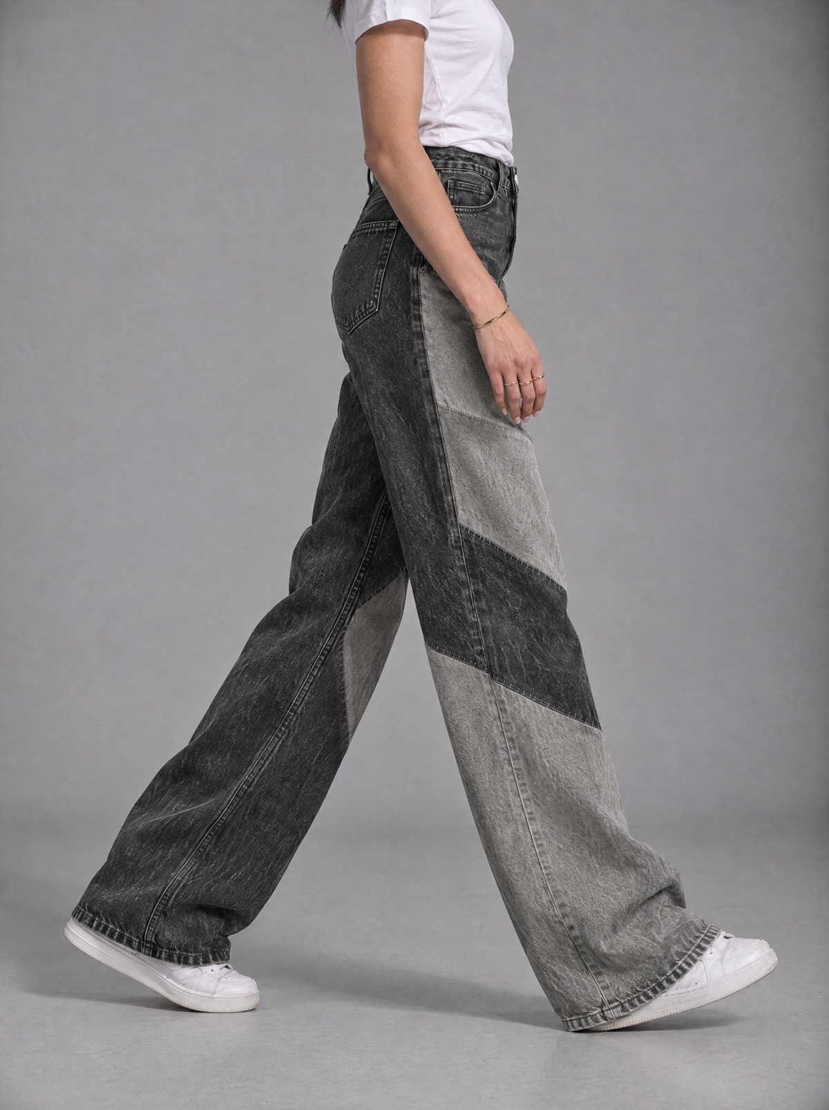 RARE Onyx black and grey patchwork wide leg jeans, side view walking