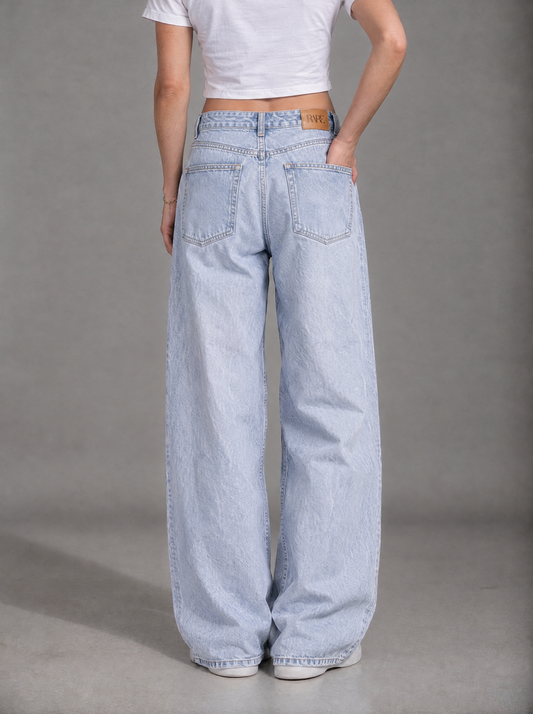 RARE Topaz icy light blue jeans, back view with tan leather RARE patch