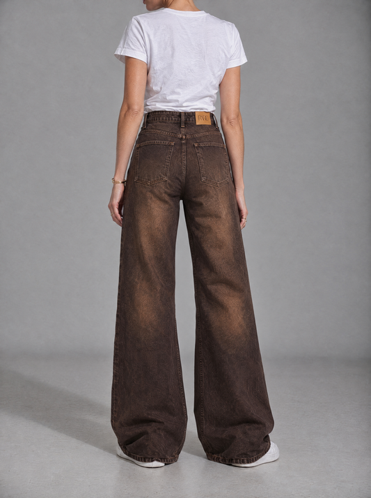 RARE Amber faded brown palazzo jeans, back view with tan leather RARE patch