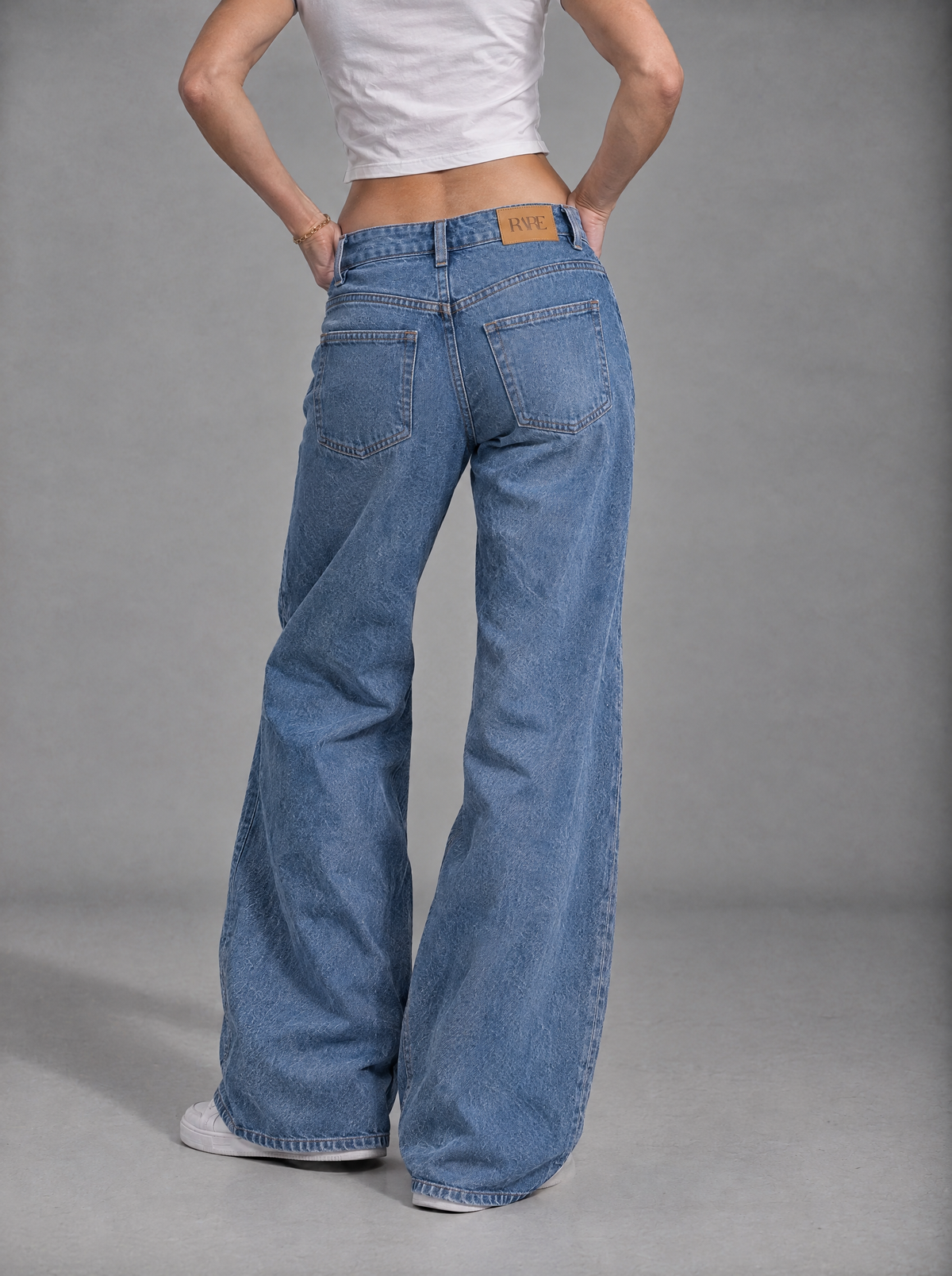 RARE Opal light blue jeans, back view with tan leather RARE patch