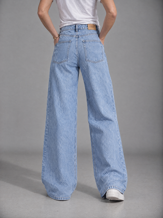RARE Pearl sky blue palazzo jeans, back view with tan leather RARE patch